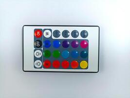 small infrared remote control keyboard for led color equipment, rgb lighting, computer desktop fans and other electronic devices isolated on white background photo
