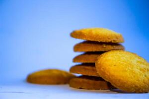 Danish butter cookies, stack of golden chocolate butter cookies isolated on white background, sweet pastry photo