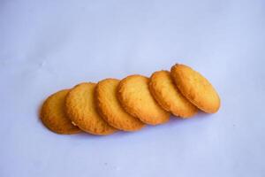 Danish butter cookies, stack of golden chocolate butter cookies isolated on white background, sweet pastry photo