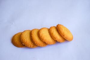 Danish butter cookies, stack of golden chocolate butter cookies isolated on white background, sweet pastry photo