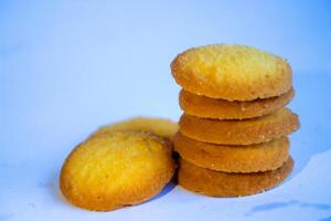 Danish butter cookies, stack of golden chocolate butter cookies isolated on white background, sweet pastry photo