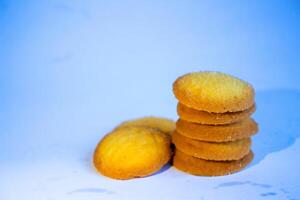 Danish butter cookies, stack of golden chocolate butter cookies isolated on white background, sweet pastry photo