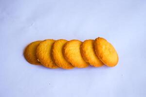 Danish butter cookies, stack of golden chocolate butter cookies isolated on white background, sweet pastry photo