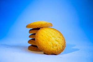 Danish butter cookies, stack of golden chocolate butter cookies isolated on white background, sweet pastry photo