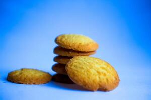 Danish butter cookies, stack of golden chocolate butter cookies isolated on white background, sweet pastry photo