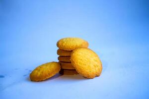 Danish butter cookies, stack of golden chocolate butter cookies isolated on white background, sweet pastry photo