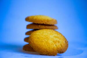 Danish butter cookies, stack of golden chocolate butter cookies isolated on white background, sweet pastry photo