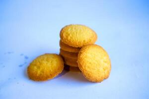 Danish butter cookies, stack of golden chocolate butter cookies isolated on white background, sweet pastry photo