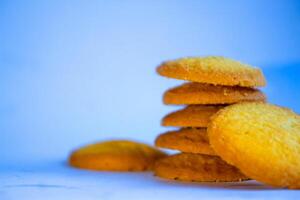 Danish butter cookies, stack of golden chocolate butter cookies isolated on white background, sweet pastry photo