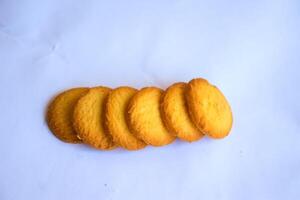 Danish butter cookies, stack of golden chocolate butter cookies isolated on white background, sweet pastry photo