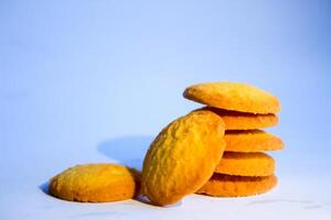 Danish butter cookies, stack of golden chocolate butter cookies isolated on white background, sweet pastry photo