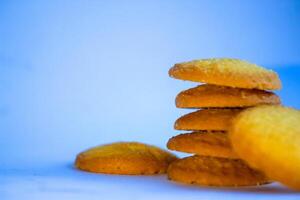 Danish butter cookies, stack of golden chocolate butter cookies isolated on white background, sweet pastry photo