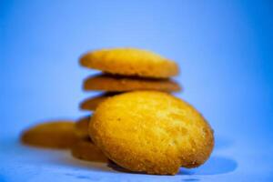 Danish butter cookies, stack of golden chocolate butter cookies isolated on white background, sweet pastry photo