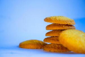 Danish butter cookies, stack of golden chocolate butter cookies isolated on white background, sweet pastry photo