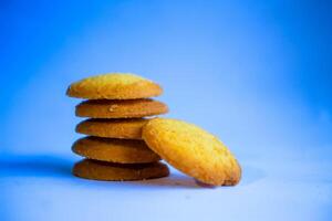 Danish butter cookies, stack of golden chocolate butter cookies isolated on white background, sweet pastry photo
