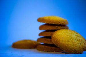Danish butter cookies, stack of golden chocolate butter cookies isolated on white background, sweet pastry photo