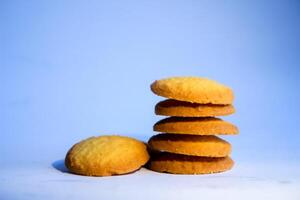 Danish butter cookies, stack of golden chocolate butter cookies isolated on white background, sweet pastry photo