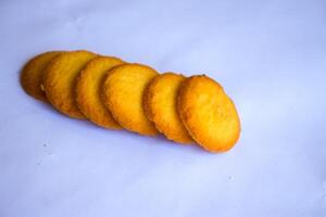 Danish butter cookies, stack of golden chocolate butter cookies isolated on white background, sweet pastry photo