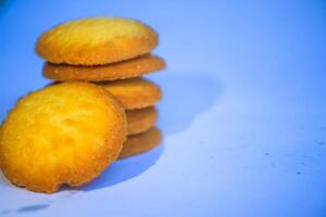 Danish butter cookies, stack of golden chocolate butter cookies isolated on white background, sweet pastry photo