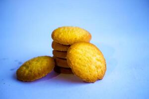 Danish butter cookies, stack of golden chocolate butter cookies isolated on white background, sweet pastry photo
