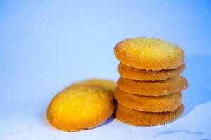 Danish butter cookies, stack of golden chocolate butter cookies isolated on white background, sweet pastry photo