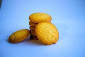 Danish butter cookies, stack of golden chocolate butter cookies isolated on white background, sweet pastry photo