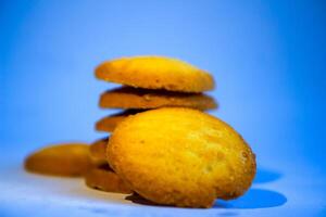 Danish butter cookies, stack of golden chocolate butter cookies isolated on white background, sweet pastry photo