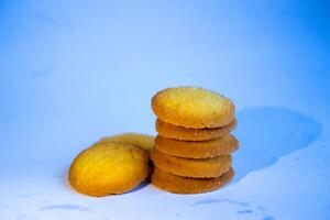 Danish butter cookies, stack of golden chocolate butter cookies isolated on white background, sweet pastry photo