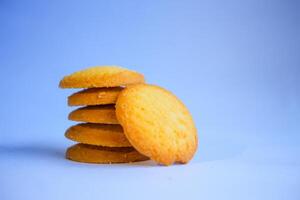 Danish butter cookies, stack of golden chocolate butter cookies isolated on white background, sweet pastry photo