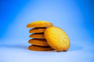 Danish butter cookies, stack of golden chocolate butter cookies isolated on white background, sweet pastry photo