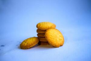 Danish butter cookies, stack of golden chocolate butter cookies isolated on white background, sweet pastry photo