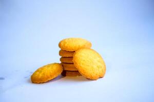 Danish butter cookies, stack of golden chocolate butter cookies isolated on white background, sweet pastry photo