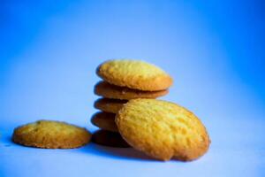Danish butter cookies, stack of golden chocolate butter cookies isolated on white background, sweet pastry photo