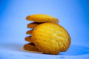 Danish butter cookies, stack of golden chocolate butter cookies isolated on white background, sweet pastry photo