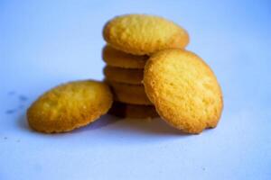 Danish butter cookies, stack of golden chocolate butter cookies isolated on white background, sweet pastry photo