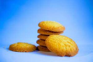 Danish butter cookies, stack of golden chocolate butter cookies isolated on white background, sweet pastry photo