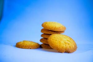 Danish butter cookies, stack of golden chocolate butter cookies isolated on white background, sweet pastry photo