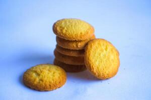 Danish butter cookies, stack of golden chocolate butter cookies isolated on white background, sweet pastry photo