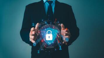 Businessman protecting data personal information on virtual interface, Network security system concept, Locked key inside a shield guard to protect personal identity, Cyber security network. photo