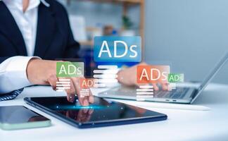 Digital marketing concept, Business woman using laptop and tablet with Ads dashboard digital marketing strategy analysis for branding, online advertisement, Ad on website and social media, SEO. photo