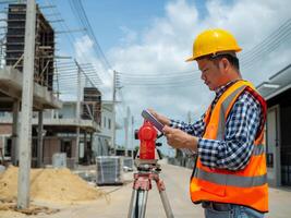 Engineers holding documents for planning and design for project at worksite, Engineering and architecture concept, Engineer working at site of a large building project. photo