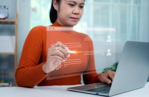 Woman hand holding a stylus pen touching a virtual screen displaying questions and answers with artificial intelligence, Machine learning, AI technology, AI brain network in business analysis. photo