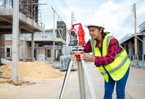 Surveyor and survey equipment on construction site, Land and soil development, Survey equipment, Theodolite for measurement construction work, Civil engineer or Architect working surveyor. photo