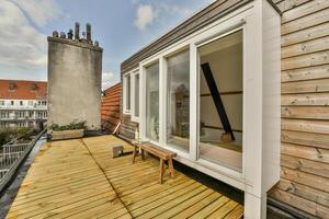 A wooden deck with a window photo