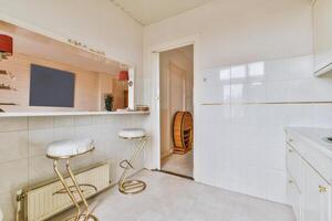 A kitchen with a sink and a counter photo