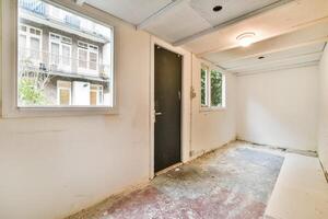 An empty room with a door and a window photo