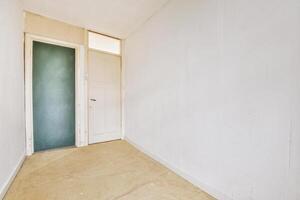 A room with a door and a green door photo