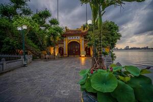 Hanoi, Vietnam - 25 Jun 2024 Tran Quoc Pagoda, the oldest Buddhist temple in Hanoi, is located on a small island near the southeastern shore of West Lake, Hanoi, Vietnam. photo