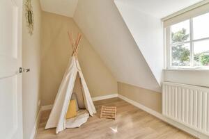 A teepee in a small room with a window photo