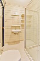 A bathroom with a shower and a sink photo